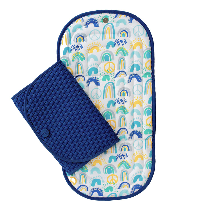 Navy blue clutch changing pad with rainbows inside.
