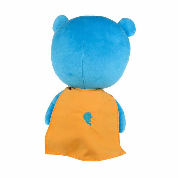 Blue plush toy with an orange cape on a white background