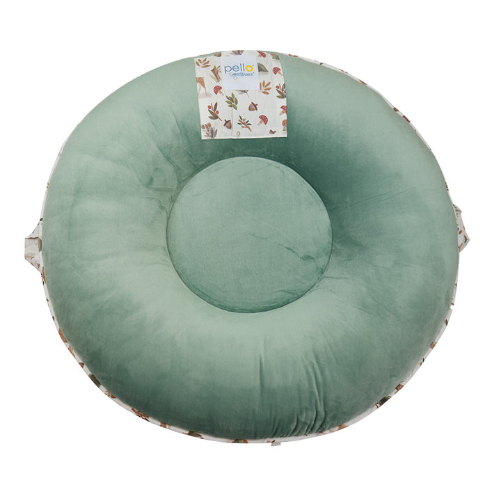 Back view of Pello's Cedar Floor Cushion showing a solid green back, peek a boo pocket and handle.